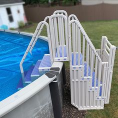 an above ground swimming pool with steps leading up to the bottom and another set of stairs next to it