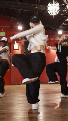 a group of young people dancing in a dance studio