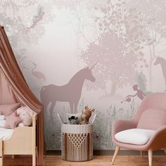 a child's bedroom decorated in pink and white with unicorns on the wall