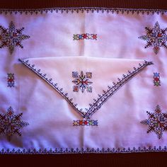 an embroidered cloth with crosses on it