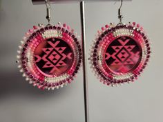 pink and white beaded earrings on display