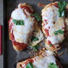 healthy baked chicken parmesan recipe on a baking sheet with text overlay that says healthy baked chicken parmesan