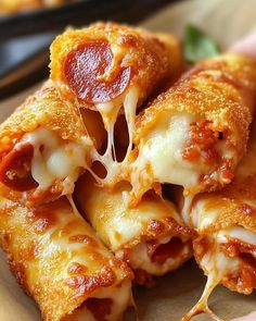 Ingredients:  1 can (8 oz) crescent roll dough 1/2 cup pizza sauce 1/2 cup shredded mozzarella cheese 1/4 cup mini pepperoni slices 1 cup crushed Nacho Cheese Doritos Directions:  Preheat Oven: Set to 375°F (190°C). Line a baking sheet with parchment paper. Assemble Rolls: Unroll crescent dough, add a spoonful of pizza sauce, sprinkle with cheese and pepperoni, and roll up. Coat with Doritos: Roll each in crushed Doritos, pressing lightly to stick. Bake: Place on baking sheet and bake for 10-12 minutes until golden and crispy. ⏰ Total: 20 min | 🔥 200 kcal/serving | 🍽️ Makes: 8 rolls  #DoritosPizzaRolls #SnackTime #EasyAppetizers #CheesyGoodness #PartyFood Doritos Pizza, Nacho Cheese Doritos, Pepperoni Roll, Gourmet Food Plating, American Foods, Crescent Dough, Crescent Roll Dough, Tasty Recipes Videos, Nacho Cheese