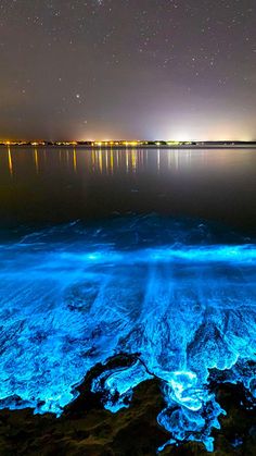 the water is very blue and it looks like something from another planet in the sky