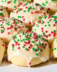 white and green sprinkle covered cookies in a box