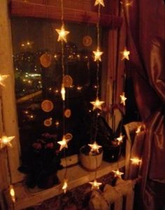 a window with stars hanging from it's side