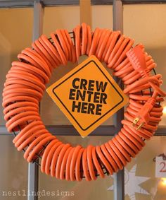 an orange wreath with the words crew enter here on it