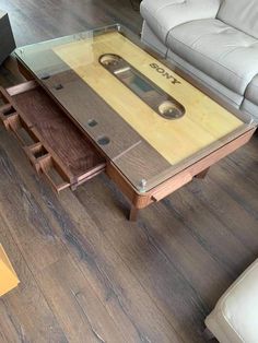 a coffee table made out of an old cassette player