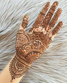 an image of someones hand with mehndrat designs on it and the caption below