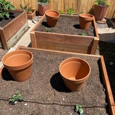 several planters are lined up on the ground