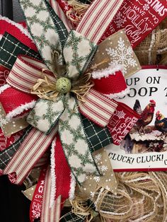 a christmas wreath with burlocks and ribbons