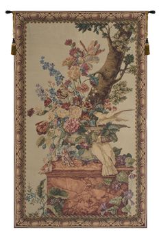 a tapestry hanging on the side of a wall with flowers and birds in it's basket