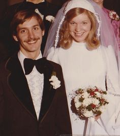 a bride and groom pose for a photo with their parents on their wedding day, circa 1970