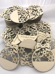 a pile of wooden cutouts with snowflakes on them