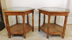 two wooden side tables with glass tops