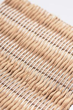 the woven material is brown and white, with some black lines on top of it