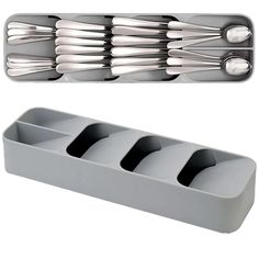 a set of four forks and spoons in a holder with two compartments for utensils