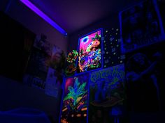 the room is lit up with neon lights and posters on the wall, along with other decorations