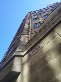 an upward view of the broadway building in new york city