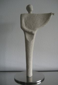 a white sculpture sitting on top of a table