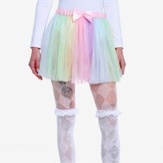 Twirl Around In A New And Colorful Tutu! This Pastel Rainbow Tulle Skirt Has A Pink Satin Elastic Waistband With A Bow At The Center. It Has Rainbow Colored Strips Of Tulle All Around! You Should Wear Something Underneath It. Style Possibilities Are Endless! Super Cute! Tulle Has A Shimmer To It! Measures About 14.5” Long And Has A 1 Inch Waistband. Waist Measures 14.5” Across When Laying Flat And Stretches Up To 20”. Spring Fairy Kei Party Skirt, White Mini Skirt In Fairy Kei Style, Spring Kawaii Skirt For Party, Spring Party Skirt In Kawaii Style, Cute Purple Party Skirt, Pink Kawaii Mini Skirt For Spring, White Fairy Kei Mini Skirt, Kawaii Spring Party Skirt, Fairy Kei White Mini Skirt