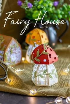 the cover of fairy house lanterns is displayed on a table with flowers and other decorations