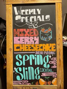 a chalkboard sign with different types of food and drinks on it's side