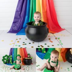 a baby boy sitting in a pot with shamrocks on the floor and rainbow streamers behind him