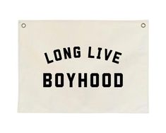 a sign that says long live boyhood on the side of a white banner with black lettering