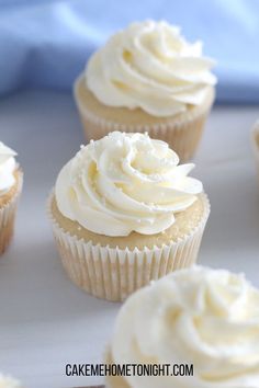 cupcakes with white frosting on top and the words, how to make white almond cupcakes