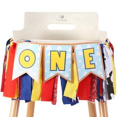 a chair with a banner that says one on it