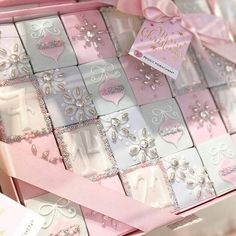 a pink and white box filled with lots of cards