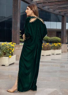 Deep forest green Velvet Kaftan delicately handworked with dabka, nakshi and zardozi on the neckline, shoulder slits, sleeves and front and back hemline and side slits. Green Embellished Kurta With Traditional Drape, Embellished Green Kurta, Green Embellished Floor-length Kurta, Evening Anarkali Gown With Cutdana, Green Maxi Length Designer Traditional Wear, Green Embellished Floor-length Traditional Wear, Embellished Green Floor-length Traditional Wear, Green Kaftan With Resham Embroidery For Festive Season, Green Embellished Straight Kurta Dress