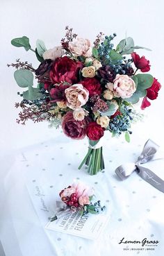 a bouquet of flowers sitting on top of a table