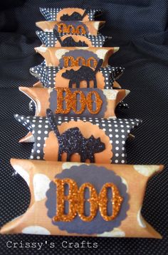 there are many decorated cookies in the shape of dogs on display for someone to decorate