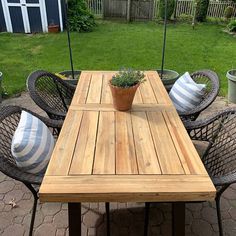 a wooden table sitting on top of a patio