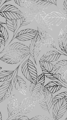 a black and white drawing of leaves on a gray background with silver glitters in the middle