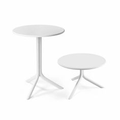 two white tables sitting next to each other