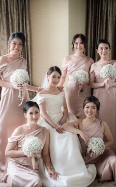 a group of bridesmaids posing for a photo