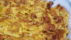 an omelet with meat and onions on a plate