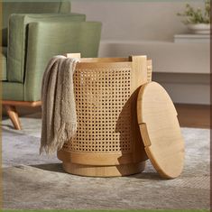 a wooden trash can sitting on top of a rug