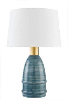 a blue table lamp with a white shade