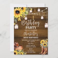 a birthday party with sunflowers, mason jars and string lights on the table