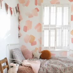 a bedroom with pink and orange paint on the walls