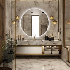 a bathroom with marble walls and flooring is shown in this image, there are lights on either side of the mirror