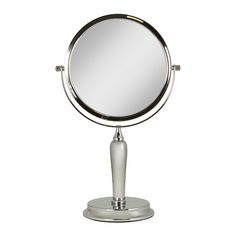 a round mirror sitting on top of a metal stand