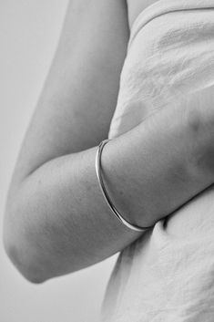 The Georgia Bangle is modern yet timeless—a minimalist bracelet featuring an organic oval shape, designed for constant wear. It is comfortable enough for sleep and sport, and strong enough to gracefully withstand decades of daily use. Each hand-soldered bracelet is shaped to mimic the contours of your forearm. Available in durable 14k gold fill, solid sterling silver, and solid 14k or 18k gold, these materials are solid (not hollow), water-resistant, and low maintenance. This bangle is truly mad Soldered Bracelet, Bangle Silver, Instagram Jewelry, Simple Organic, Bracelet Style, Classy Jewelry, Minimalist Bracelet, Gold Bangles, Shape Design