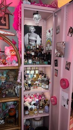 a pink closet filled with lots of stuff