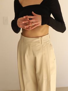 Your perfect summer beige cotton trousers, featuring a high rise, front pleating detailing and a wide straight leg. Also have pockets and belt loops. 55% cotton | 45% rayon, Lining: 100% polyester Made in Korea X-Small: 24" waist, 38" hip, 14" rise, 29" inseam Small: 26" waist, 40" hip, 14" rise, 29" inseam Medium: 28" waist, 42" hip, 14" rise, 29" inseam Large: 30" waist, 44" hip, 14" rise, 29" inseam Cream Wide Leg Pants With Belt Loops, Chic Beige Chinos For Work, Chic Beige Chinos For Spring, Trendy Beige Wide Leg Pants For Business Casual, Chic Beige Ankle-length Chinos, Chic Beige Straight Leg Chinos, Cotton Trousers, Pleated Pants, Perfect Summer