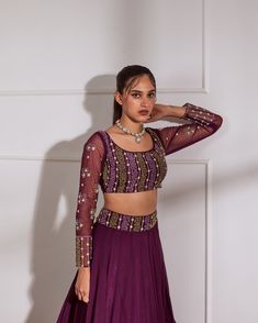 Wine fully embroidered choli with net sleeves paired with inserted kali lehenga and wine net dupatta. No. of pieces in a set: 3 Color: Wine Fabric Composition: Opada silk, net georegette Lining Material: Shantoon Closure used: Side zip in both choli and lehenga Dress Length : Full Silhouette: Kalidaar Neck type : Round neckline Sleeve Length: full Sleeves Waistline: High waist Prints/ Pattterns : Plain Delivery Time: 20-25 days Embellished Fitted Traditional Sets, Fitted Sharara With Cutdana For Party, Anarkali Party Sets With Cutdana, Fitted Cutdana Sharara For Party, Semi-stitched Cutdana Sets For Reception, Purple Cutdana Lehenga For Party, Semi-stitched Cutdana Lehenga For Party, Purple Anarkali Set With Unstitched Blouse For Reception, Embellished Purple Georgette Set